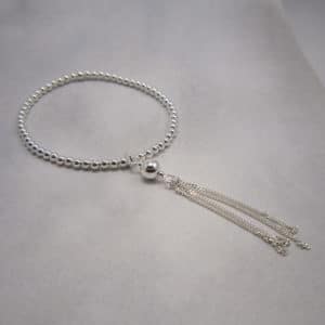 sterling silver stretch bracelet with 4 chain drops